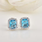 Emerald Cut Halo Swiss Blue Topaz Brass Stud Earrings