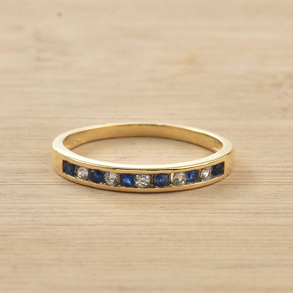 0.03 Ct Round Blue Sapphire Eternity Band Ring 925 Sterling Silver Yellow Plated