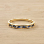 0.03 Ct Round Blue Sapphire Eternity Band Ring 925 Sterling Silver Yellow Plated