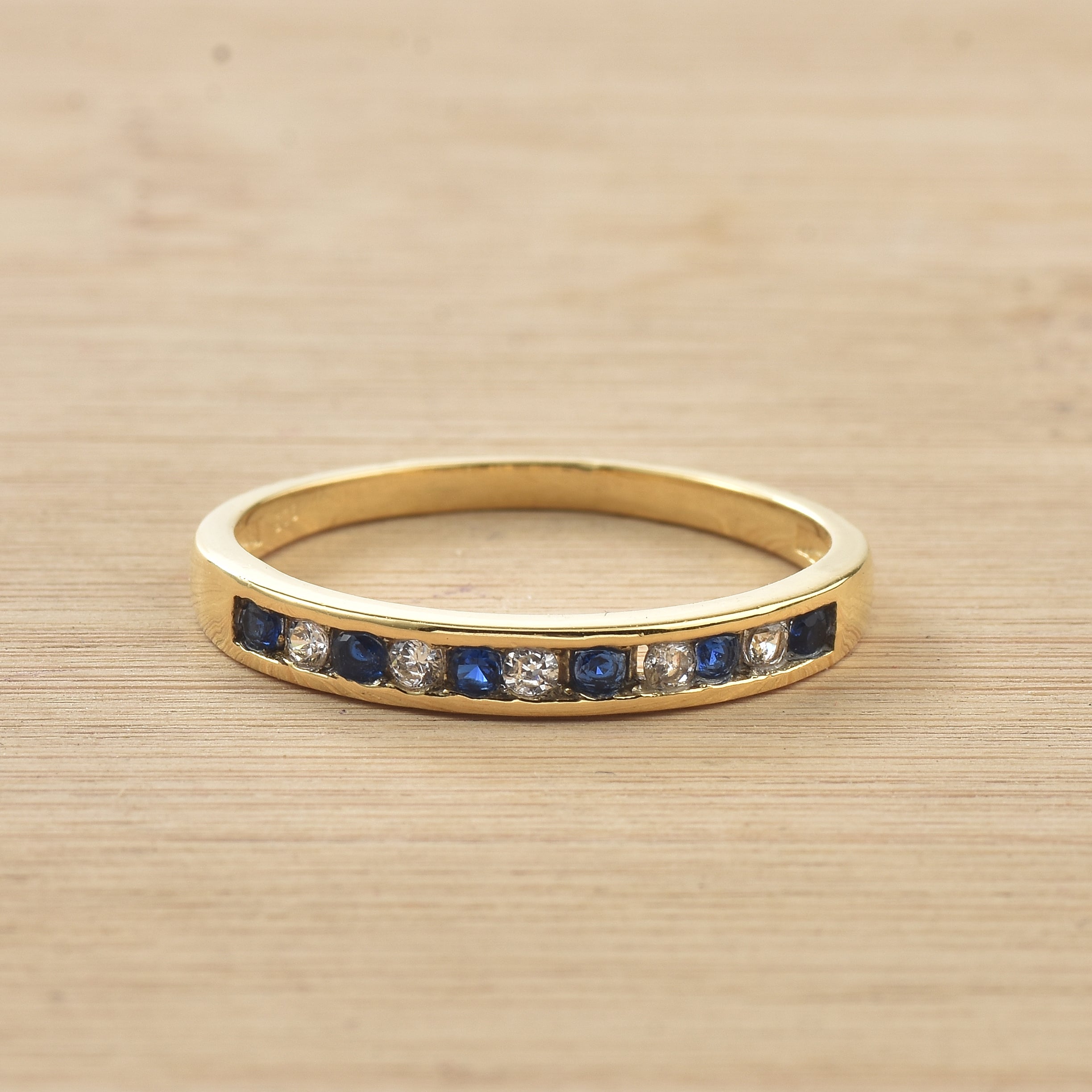 0.03 Ct Round Blue Sapphire Eternity Band Ring 925 Sterling Silver Yellow Plated