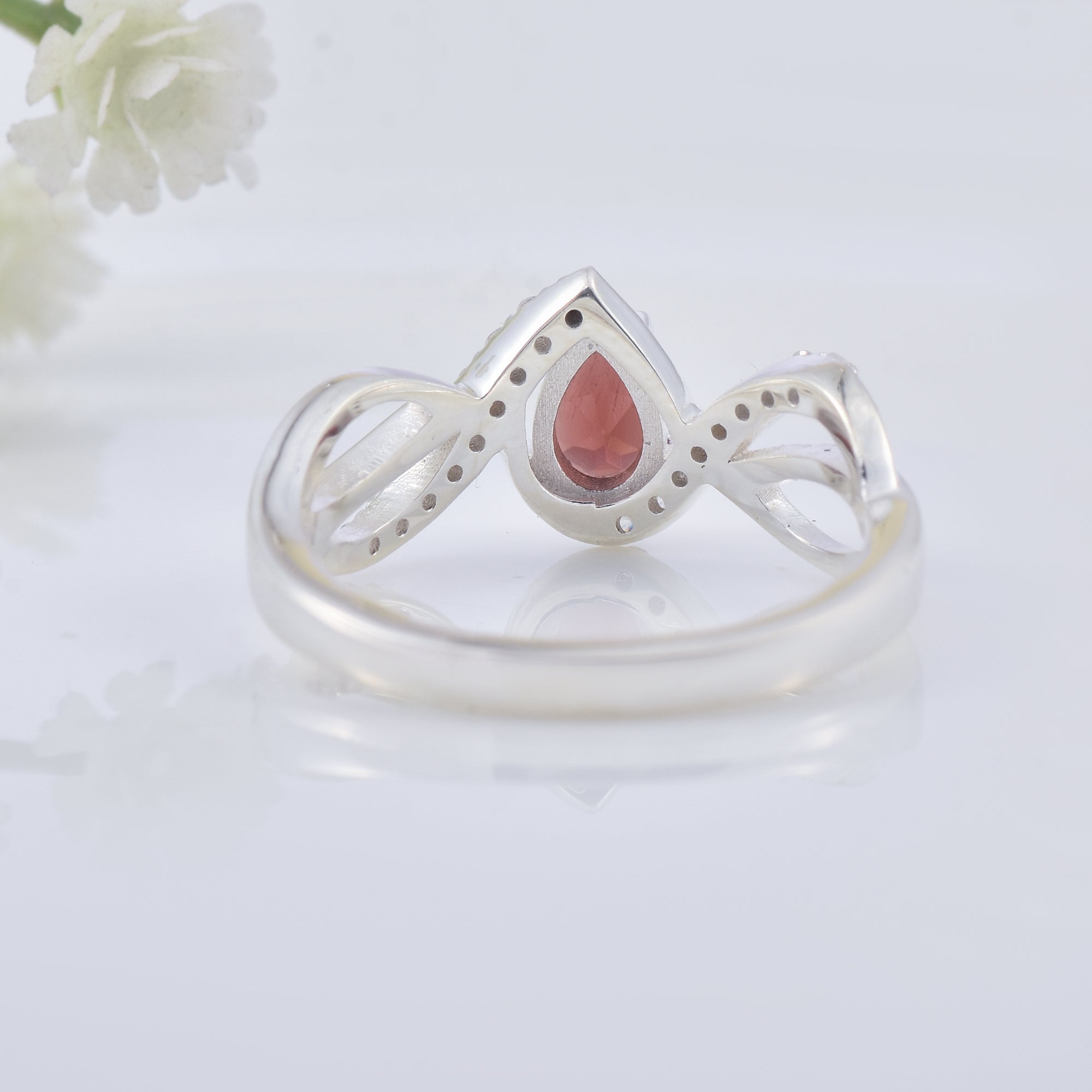 0.70 Ct Pear Shape Rhodonite Garnet Infinity Twist Ring 925 Sterling Silver