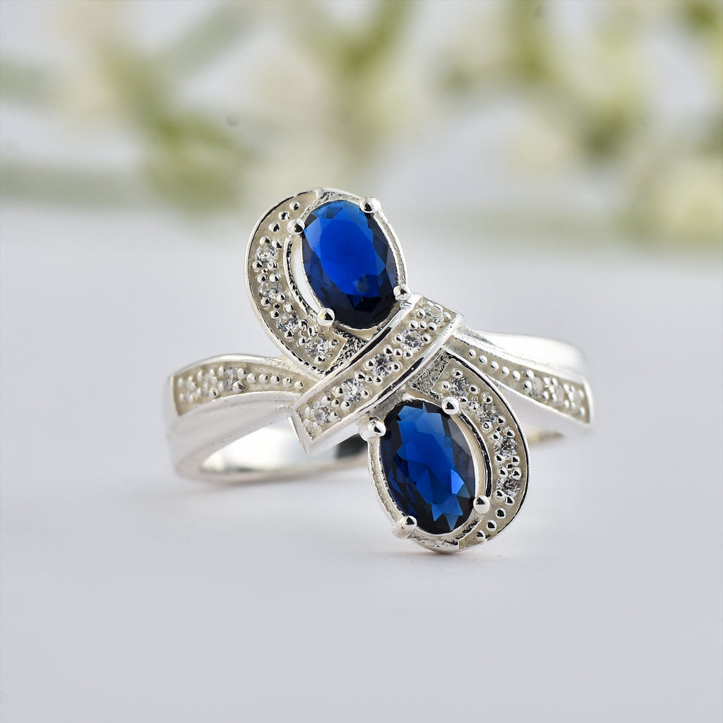 6x4mm Oval Blue Sapphire Crossover Ring - 925 Sterlign Silver