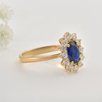 925 Sterling Silver 8x6MM Oval Blue Sapphire Halo with CZ Accents Ring