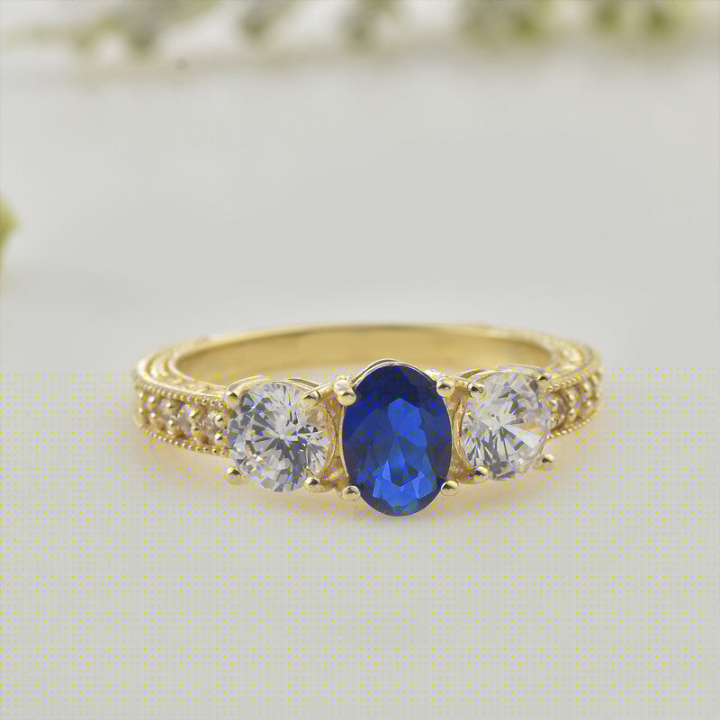 925 Sterling Silver Yellow Played 7x5mm Oval Blue Sapphire Three-Stone Ring