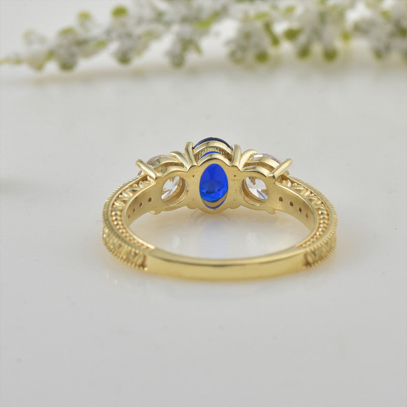 925 Sterling Silver Yellow Played 7x5mm Oval Blue Sapphire Three-Stone Ring