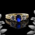 925 Sterling Silver Yellow Played 7x5mm Oval Blue Sapphire Three-Stone Ring