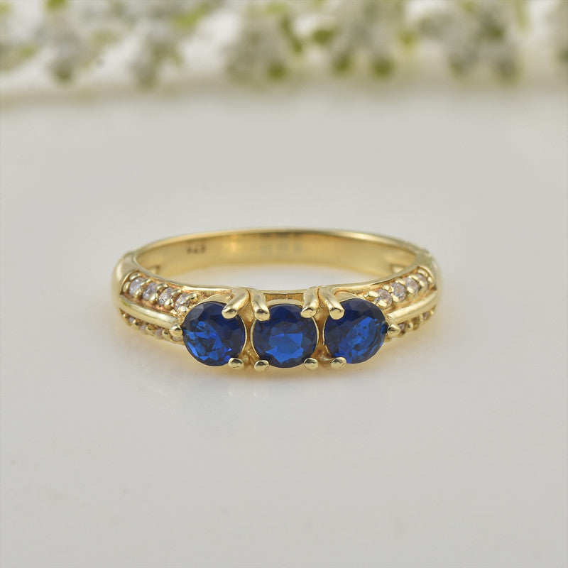 925 Sterling Silver Yellow Plated 4x4mm Round Blue Sapphire Three-Stone Ring