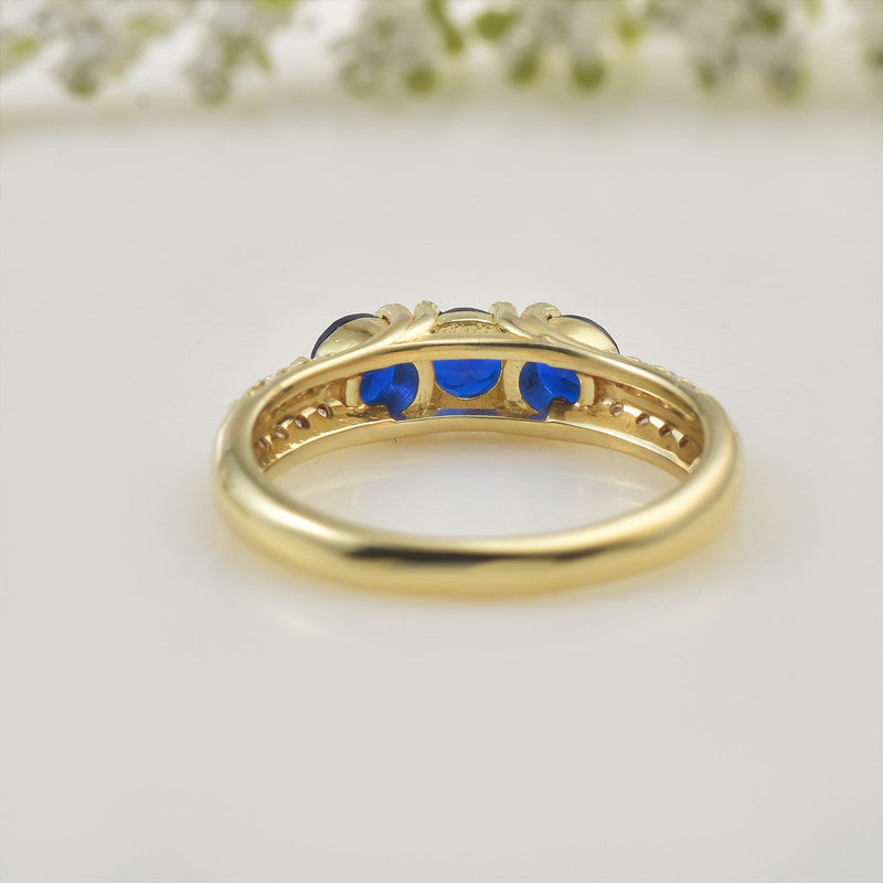 925 Sterling Silver Yellow Plated 4x4mm Round Blue Sapphire Three-Stone Ring
