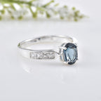 6x4mm Oval London Blue Topaz with CZ Accents Ring 925 Sterling Silver